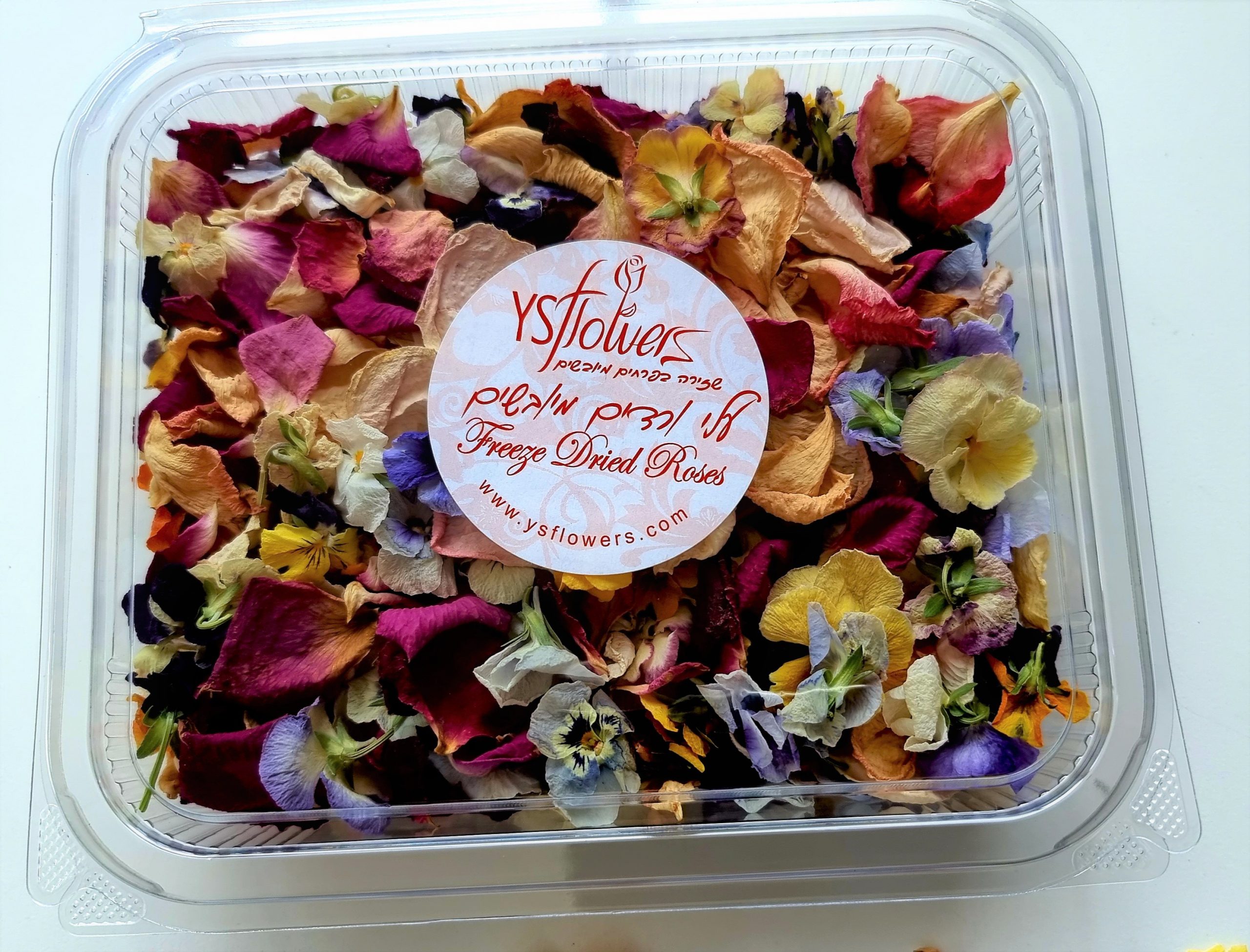 Dried rose petals with dried pansies.